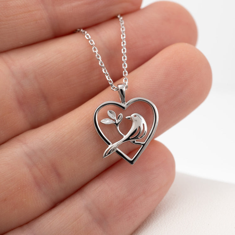 silver bird in heart necklace