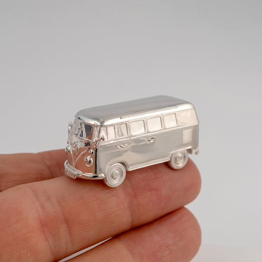 Sterling silver VW camper van miniature shown in hand for scale