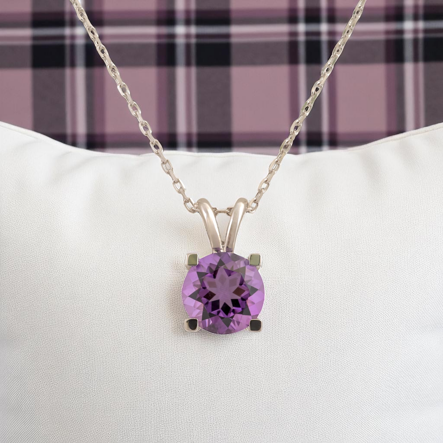 amethyst-pendant-display-cushion-tartan-background
