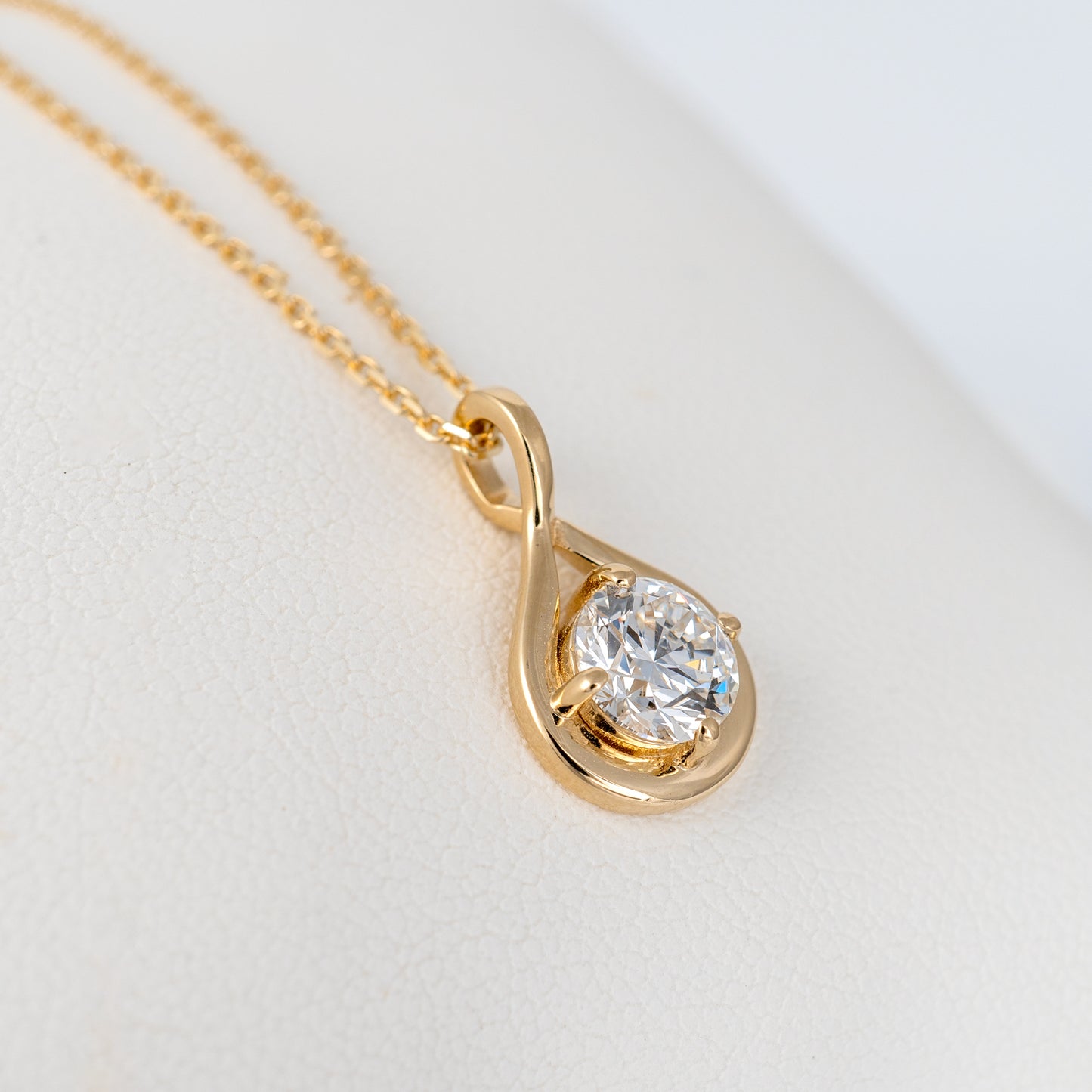 Side view of lab grown diamond infinity necklace showing infinity design