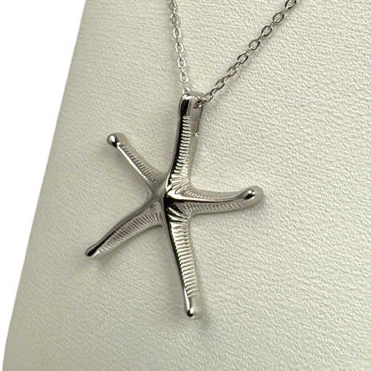 silver starfish necklace showing textured detail integral bail