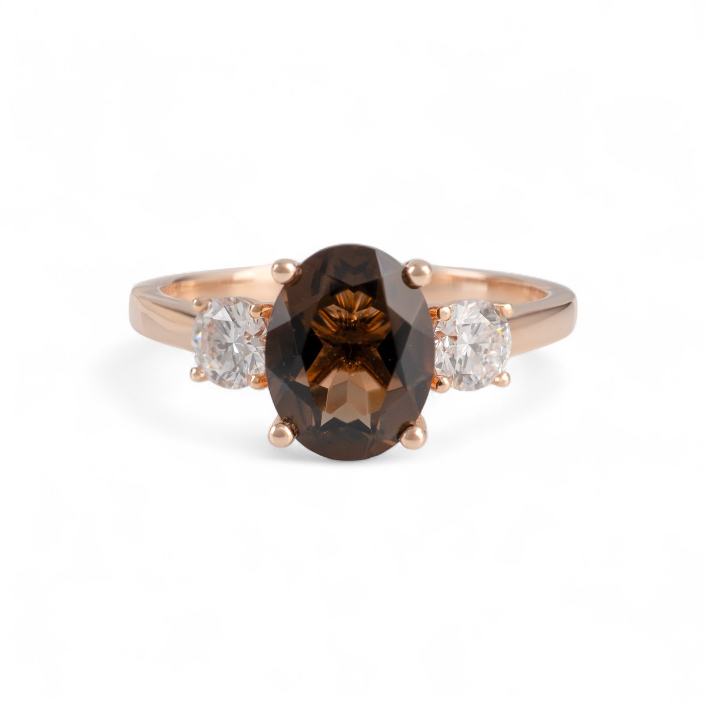 smoky quartz ring with a brown gemstone and two smaller diamonds on a white background