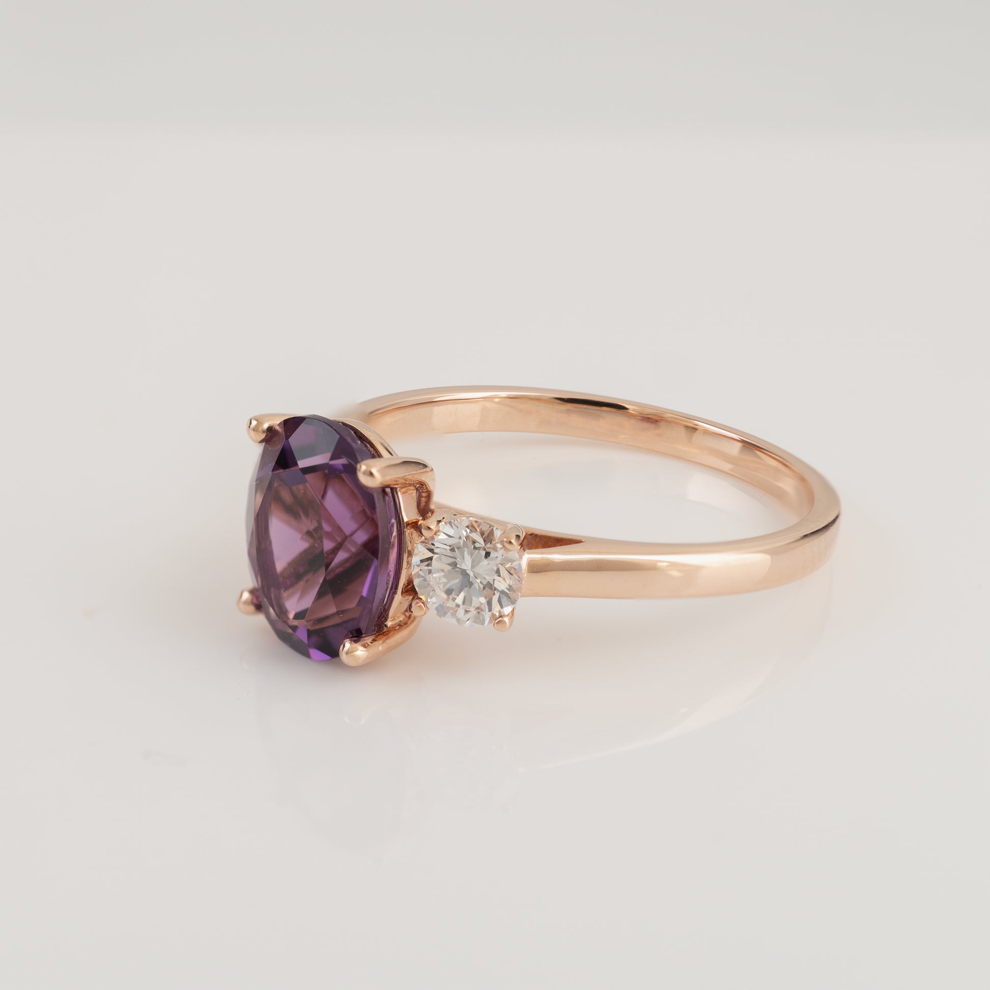 Amethyst and diamond three stone ring in 9ct rose gold – side view
