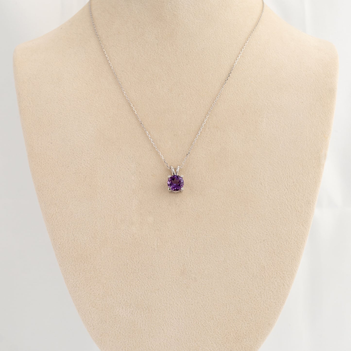 Amethyst pendant necklace on bust showing scale and chain length