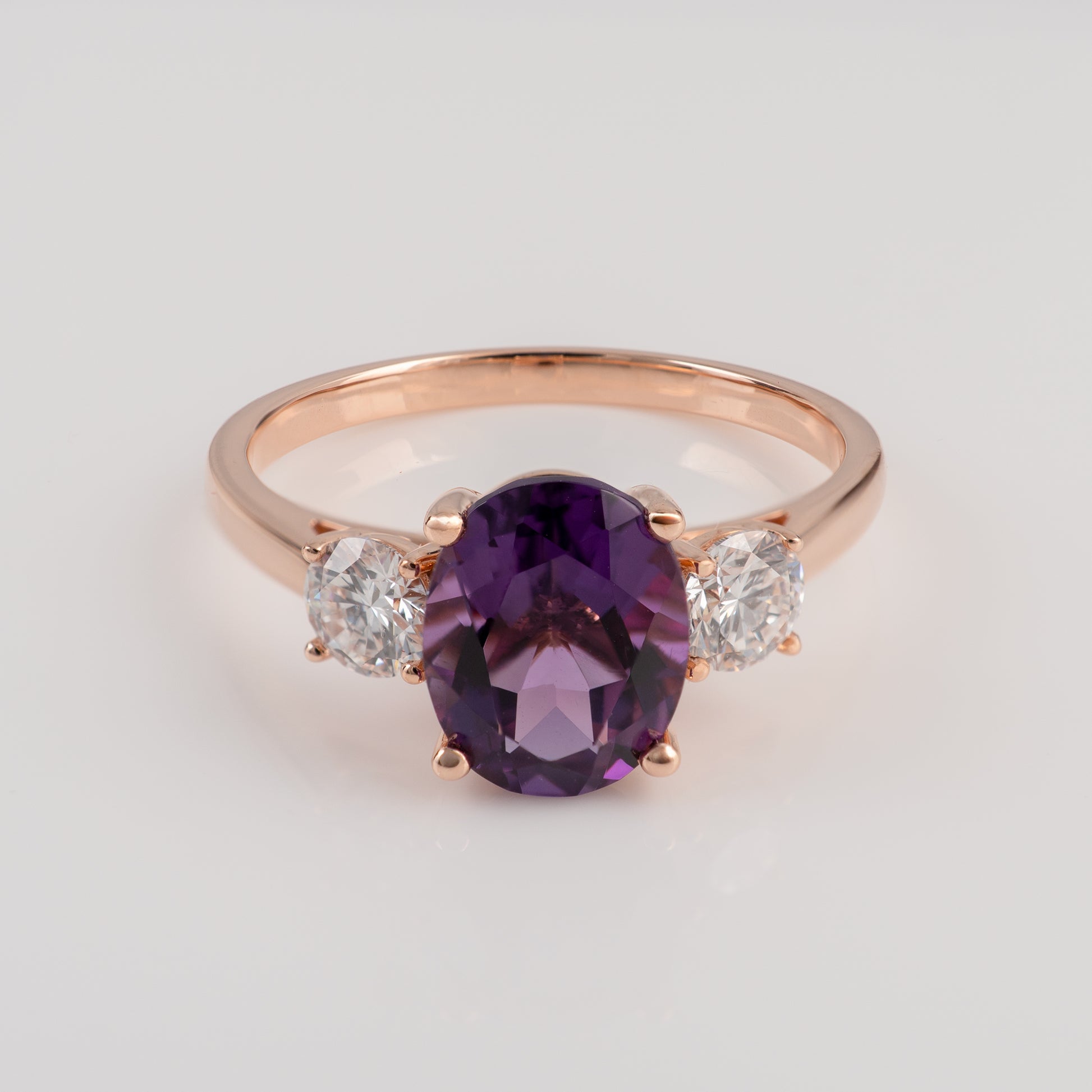 Natural amethyst ring gold in 9ct rose gold with diamonds – angled front view