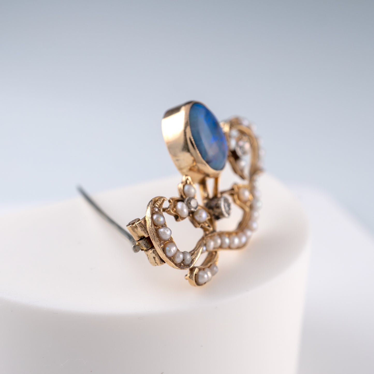 Side view of antique opal brooch showing opal setting