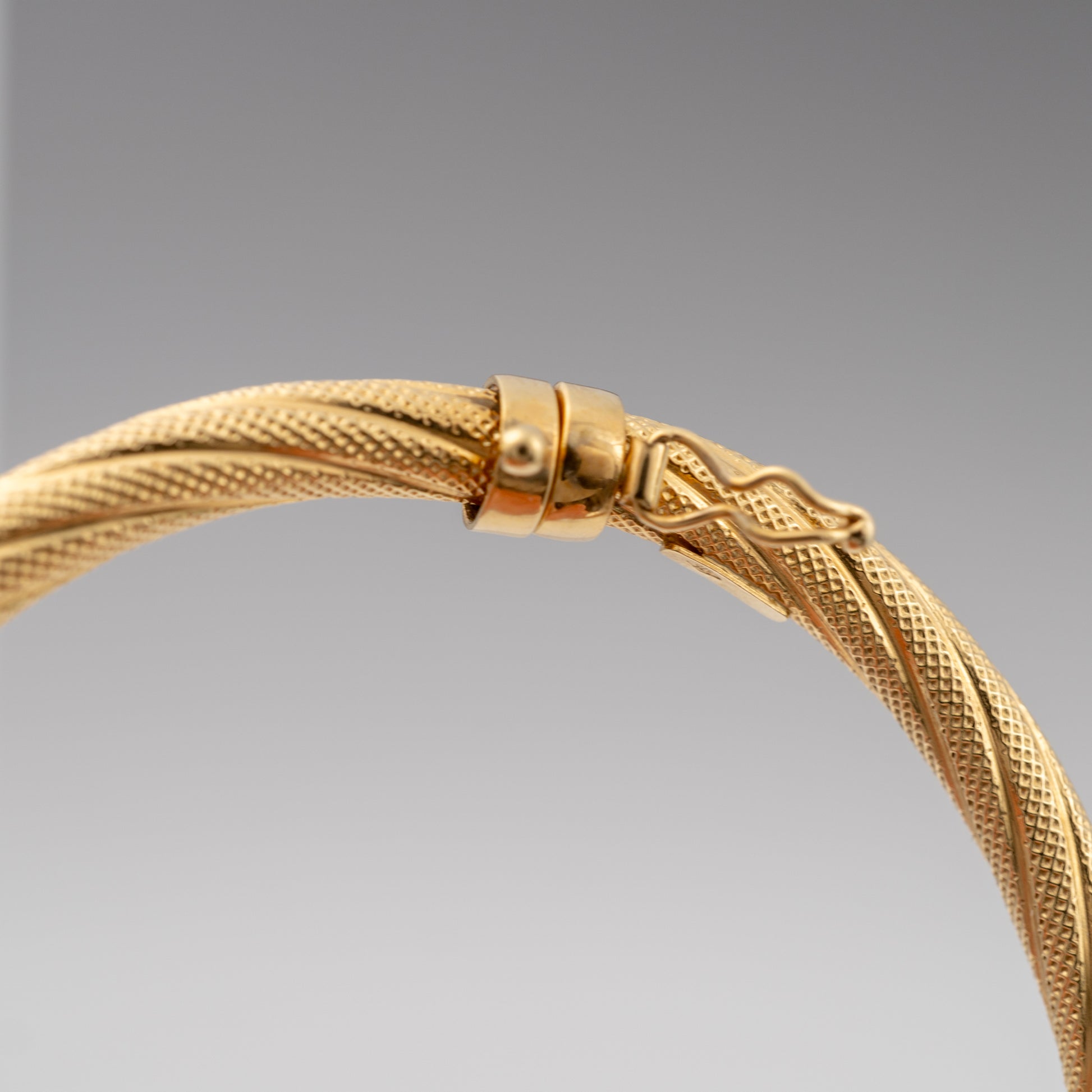 Gold bracelet bangle with hidden lock feature