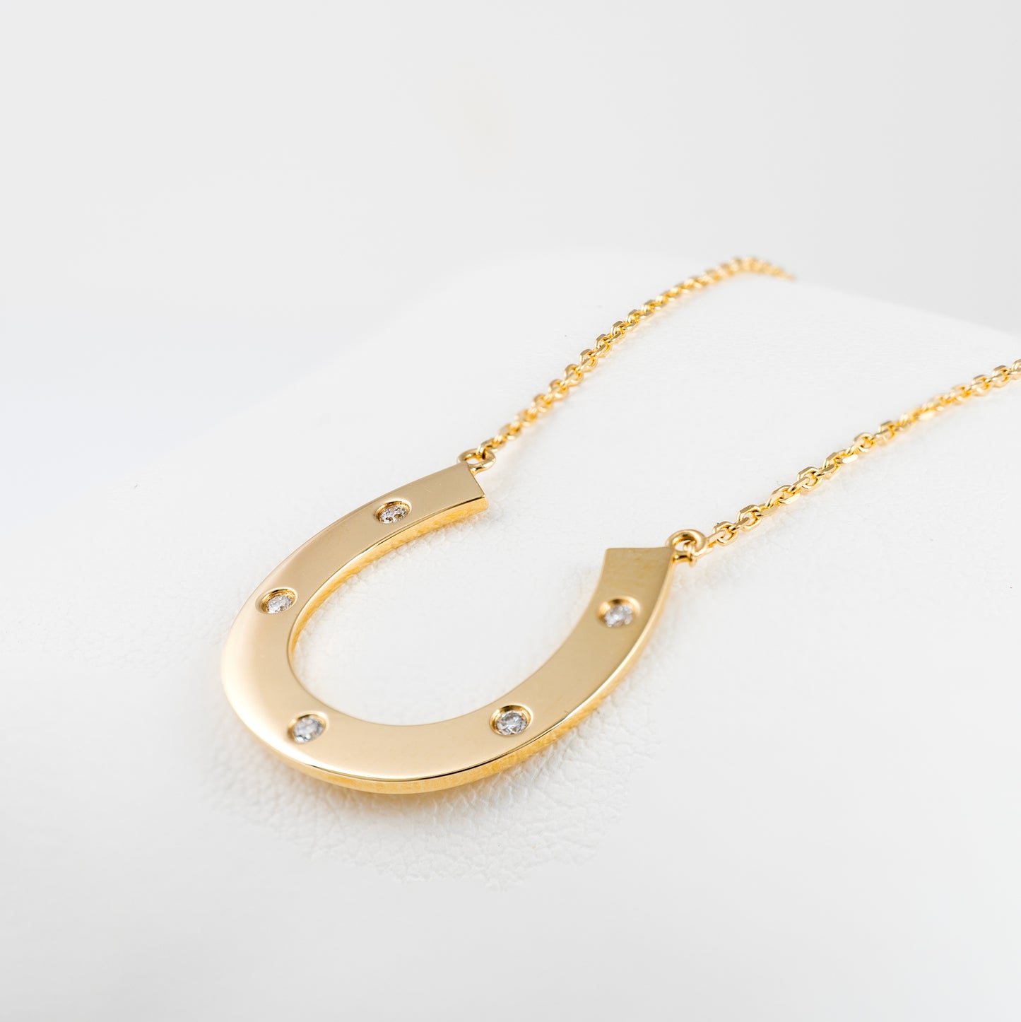 Lucky 9ct gold horseshoe necklace with diamonds