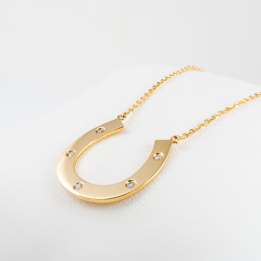 Lucky 9ct gold horseshoe necklace with diamonds