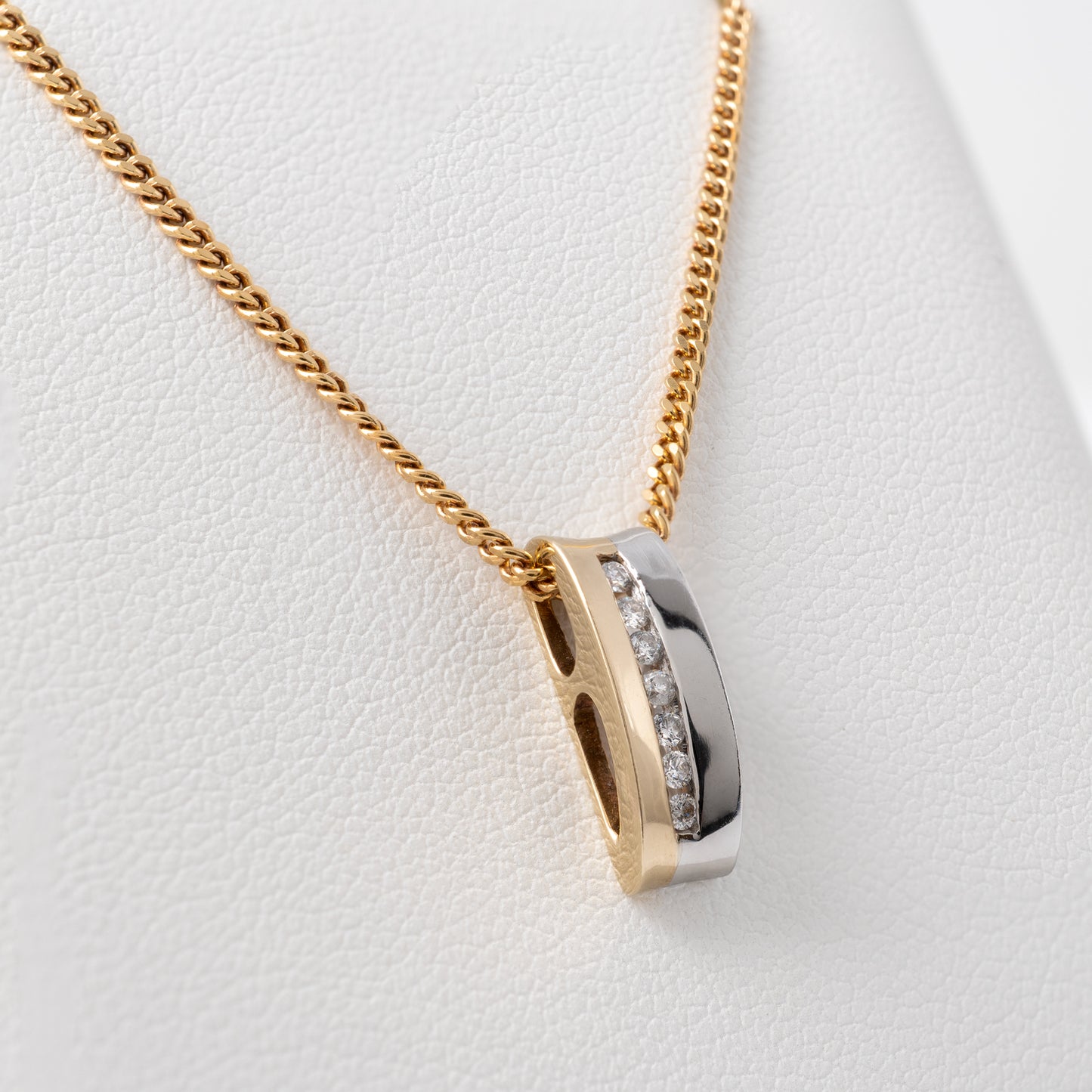 Two-tone gold diamond bar necklace close-up showing the two tone gold Finish