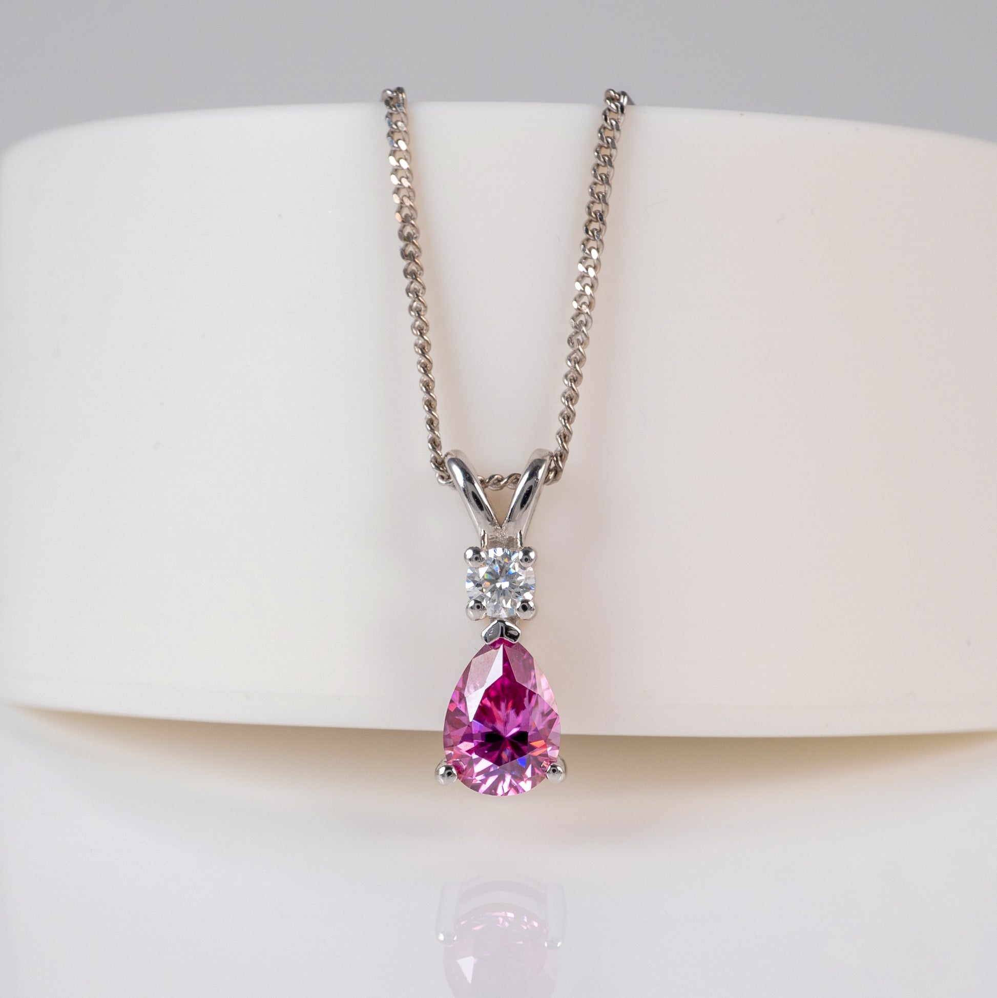 front view of pink moissanite teardrop pendant in sterling silver