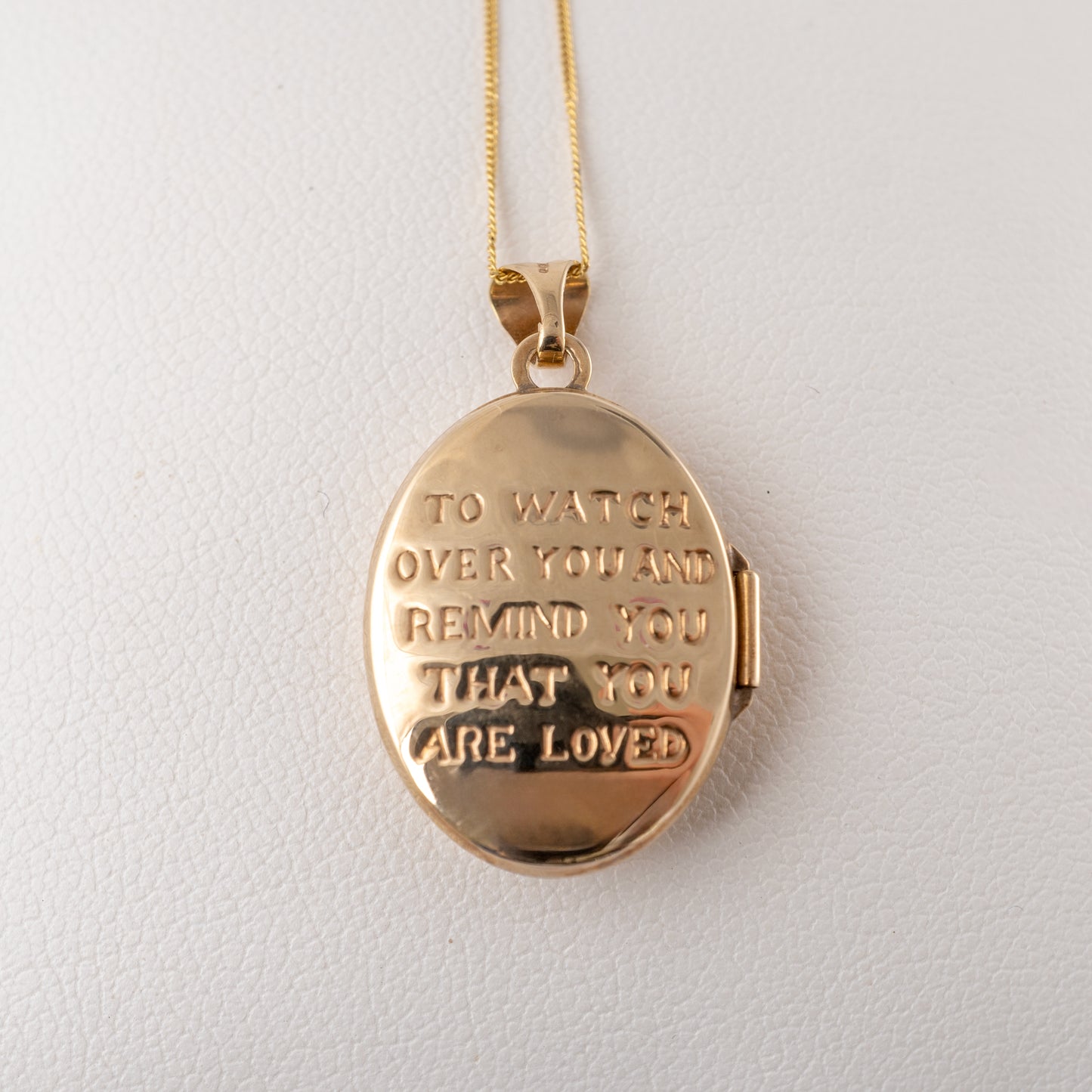 Reverse of 9ct gold cherub pendant locket with engraved message – Hunters Fine Jewellery