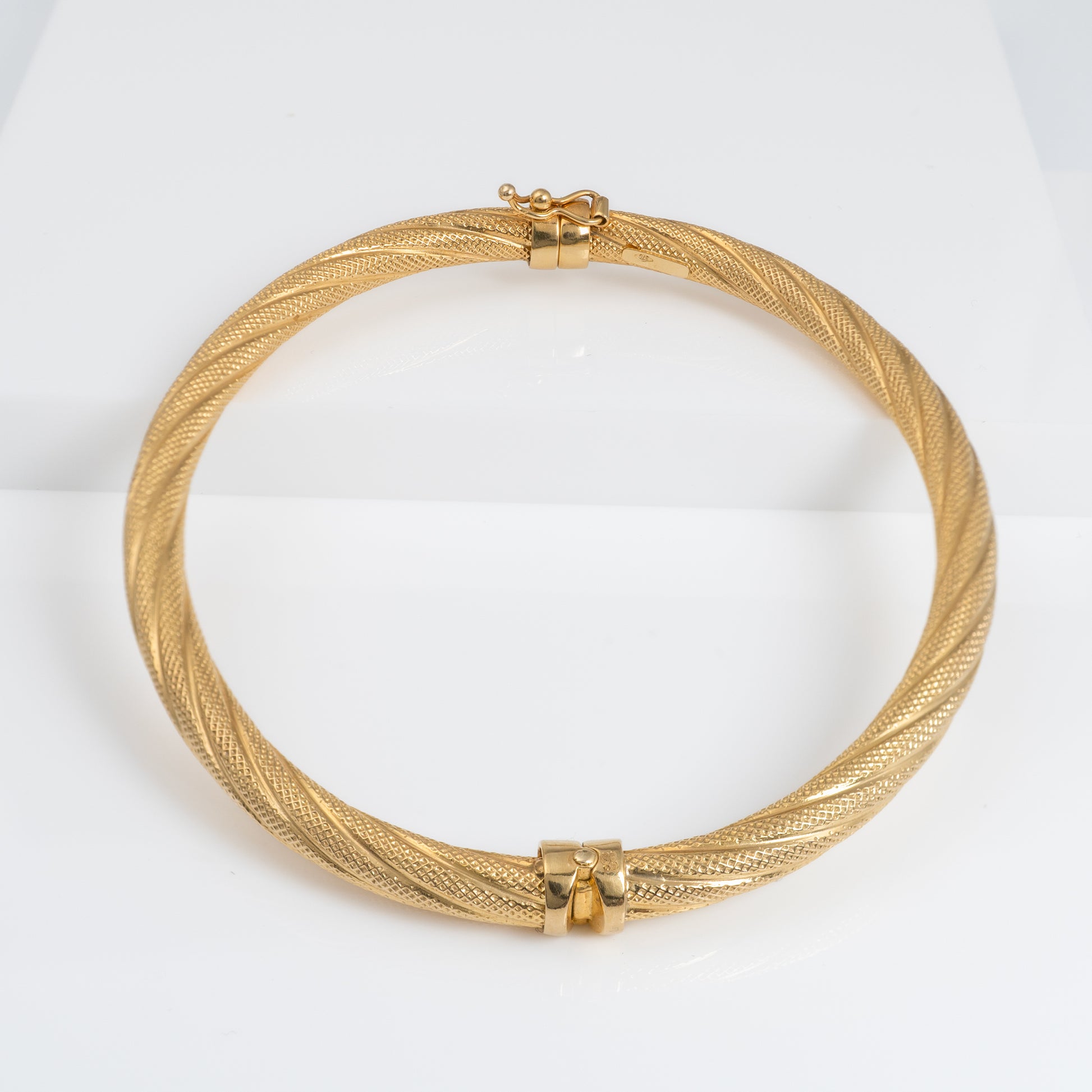 Italian textured gold bracelet with safety lock