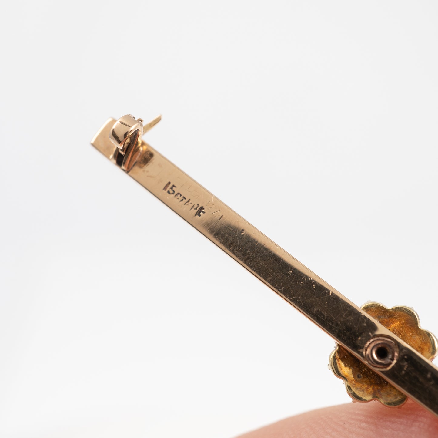 diamond brooch showing hallmark on the back of the bar