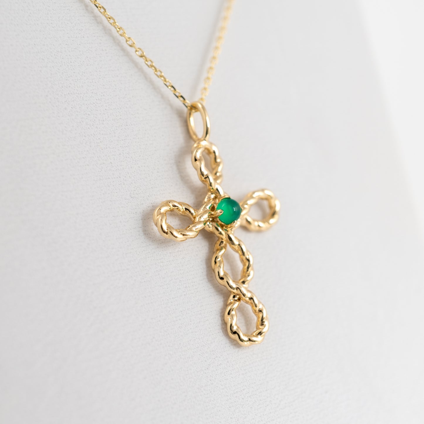 yellow gold crucifix pendant with green onyx cabochon 