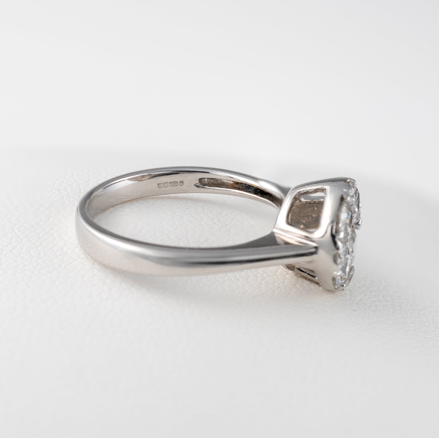 white gold ring with London assay hallmarks
