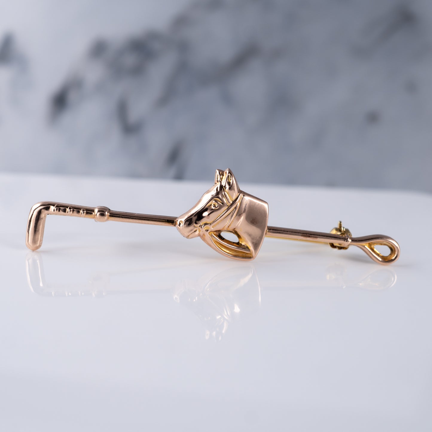 gold horse head crop brooch