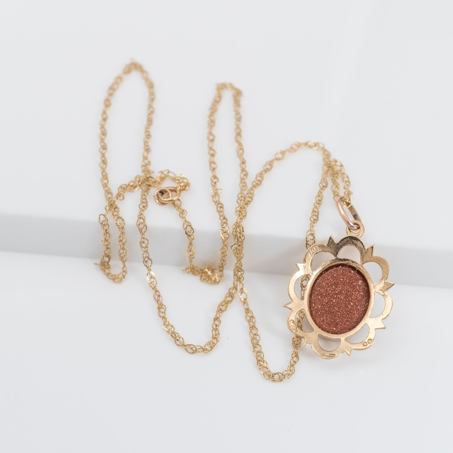 goldstone necklace on fancy rope chain