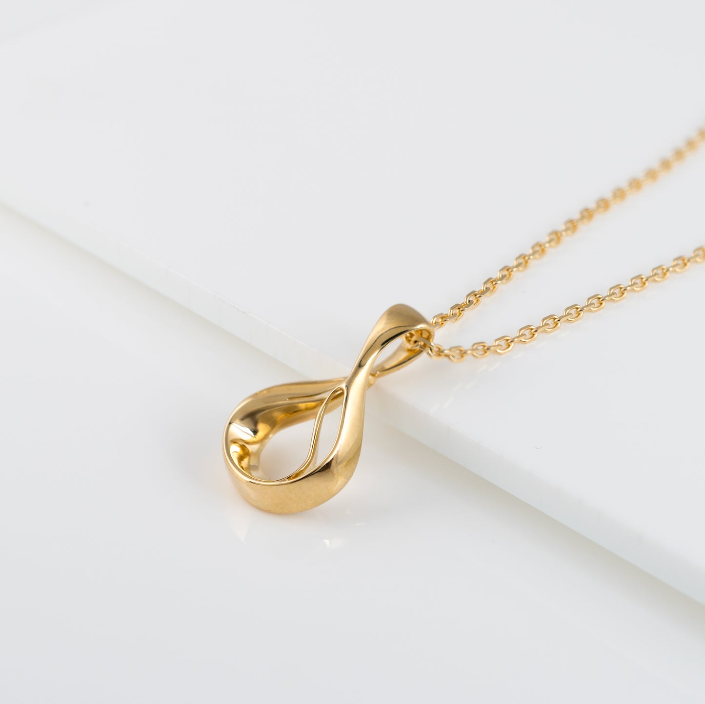 Gold teardrop necklace side view