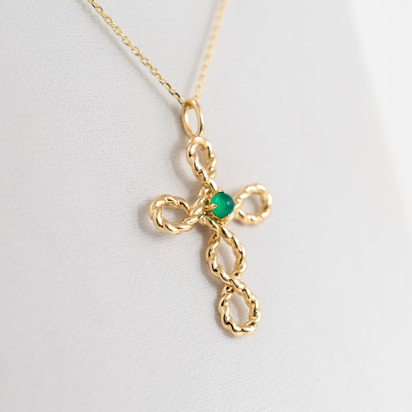 gold cross necklace side view