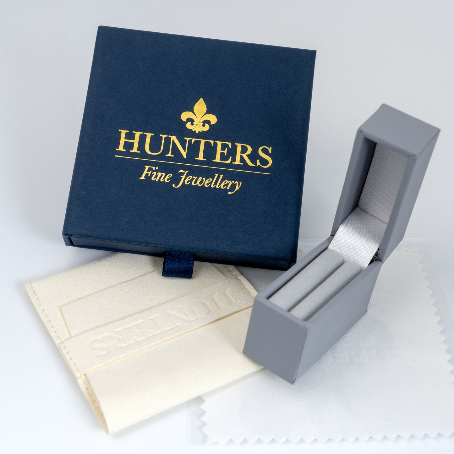 Hunters Fine Jewellery box with gold thistle pendant packaging and polishing cloth