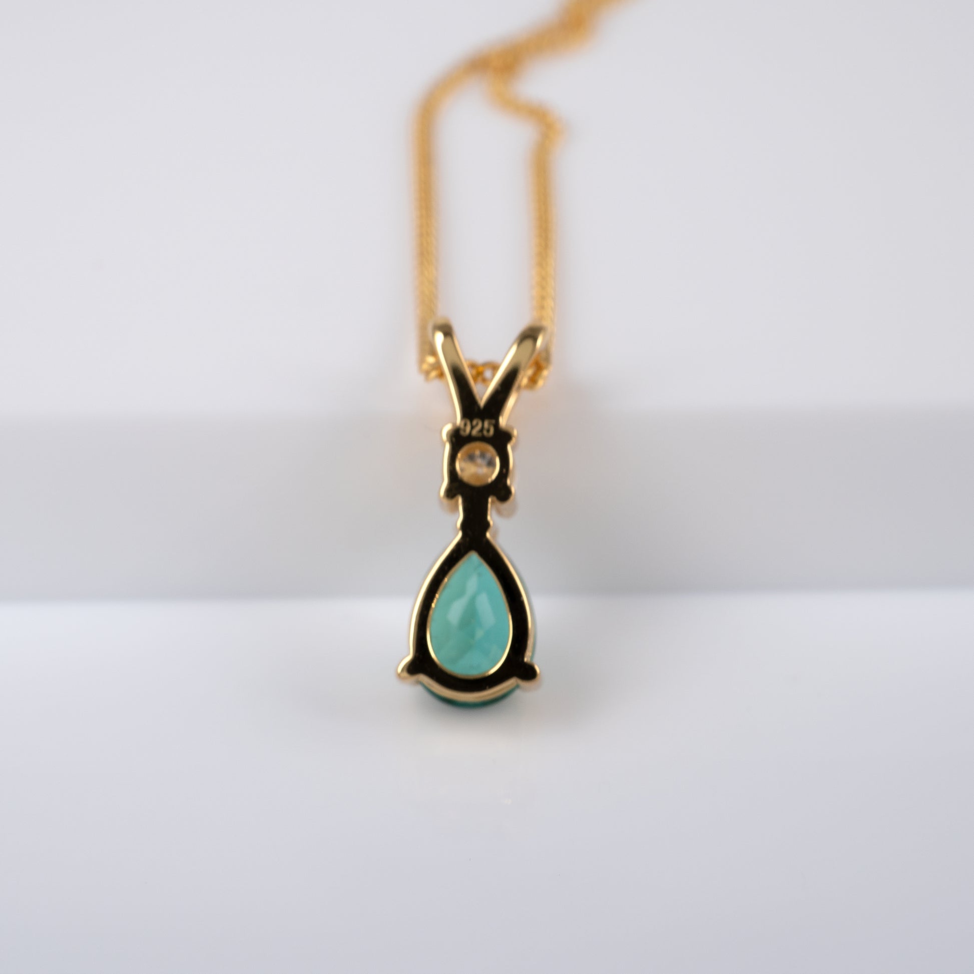 Rear view of lab emerald pendant in gold vermeil setting