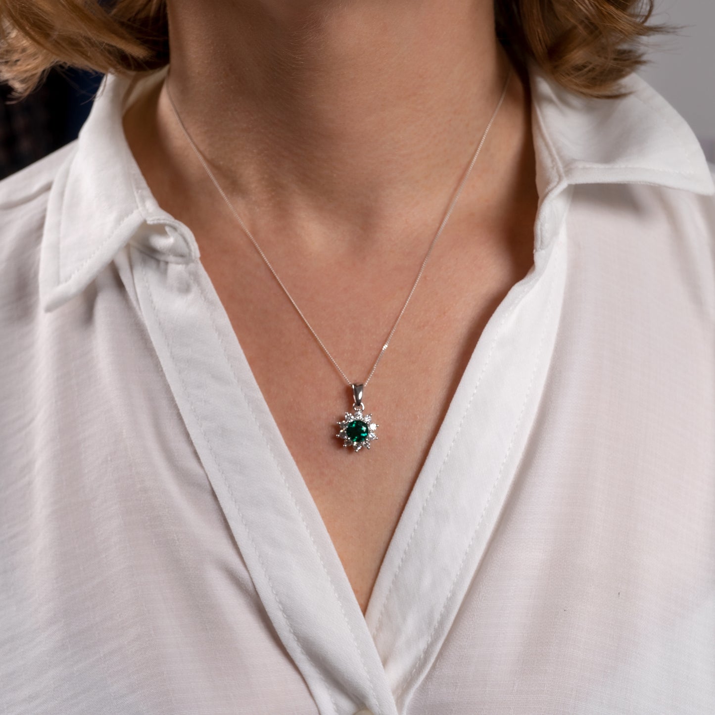 Lab grown emerald necklace worn on model – moissanite halo on adjustable silver chain