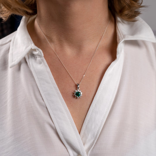 Lab grown emerald necklace worn on model – moissanite halo on adjustable silver chain
