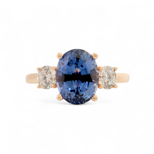Lab grown sapphire ring in rose gold with oval centre and diamond sides