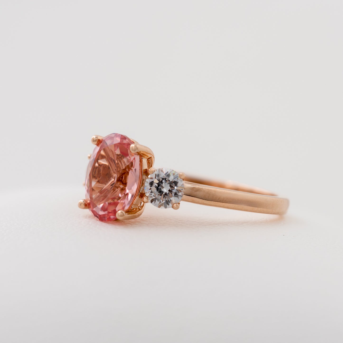 Side view of lab created padparadscha sapphire ring with lab diamonds – Hunters Fine Jewellery