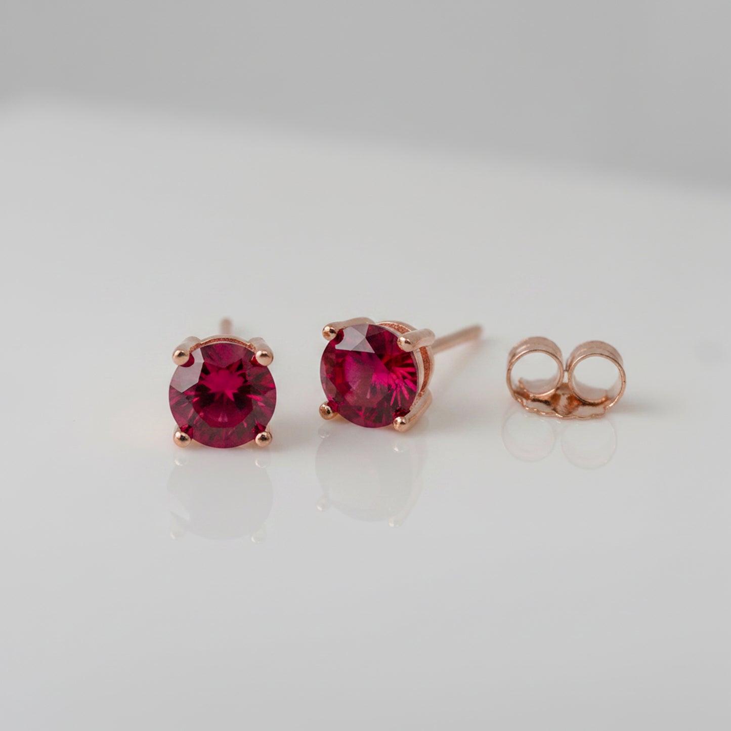 lab grown ruby earrings with rose gold finish