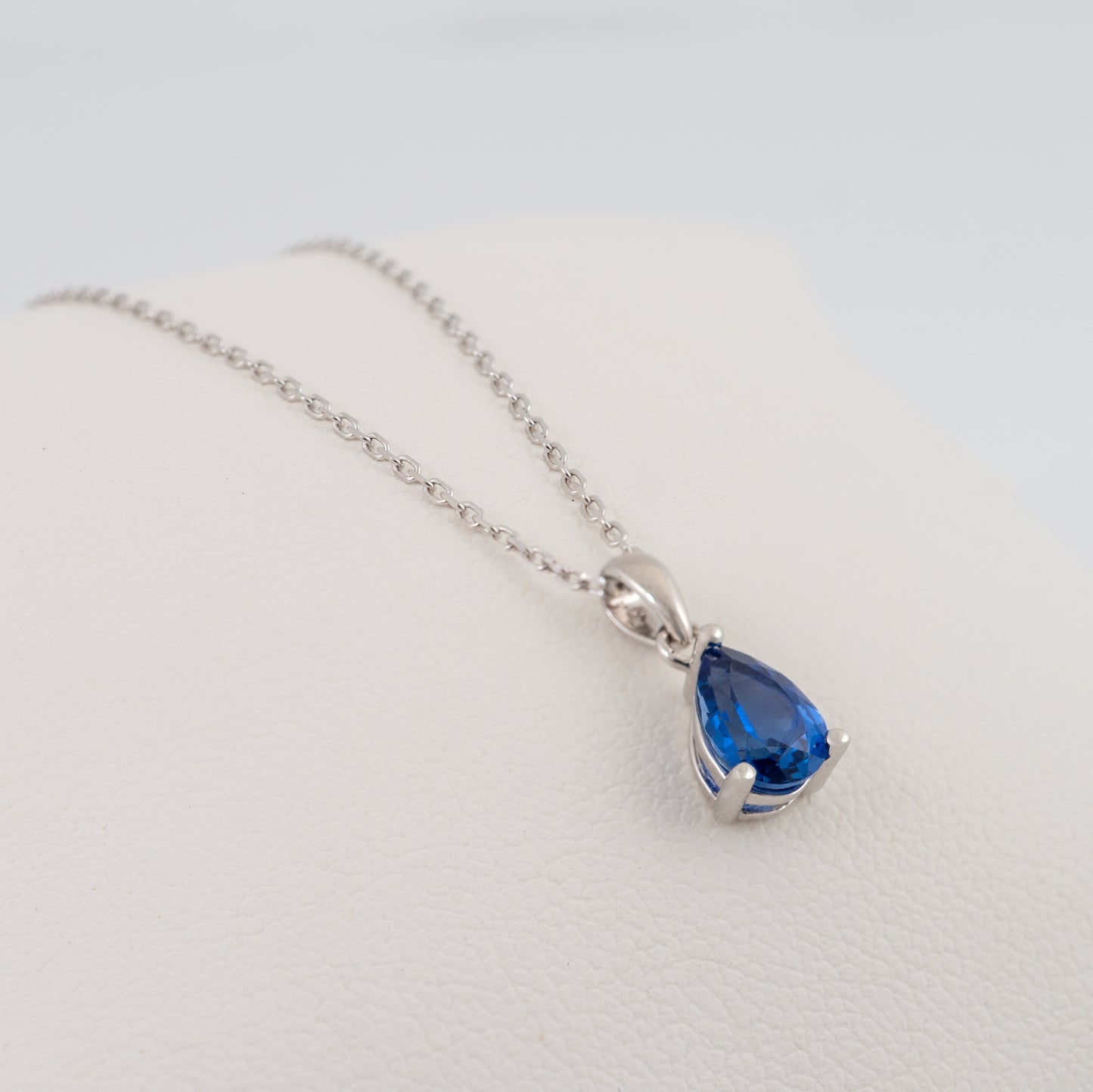 lab sapphire teardrop necklace close side view showing stone