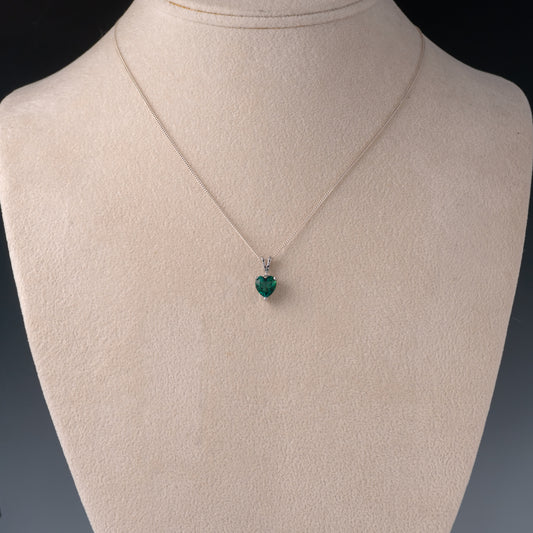 emerald heart necklace on display bust