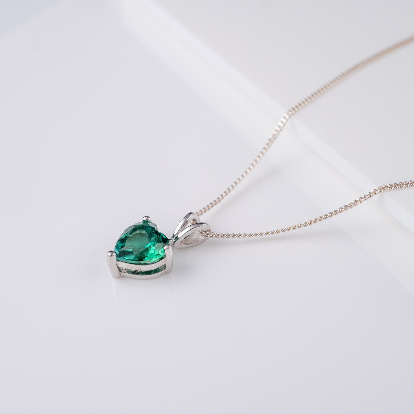 lab grown emerald heart necklace silver side view