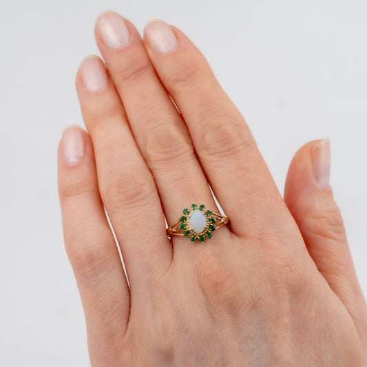 woman hand wearing opal emerald gold ring hunters fine jewellery