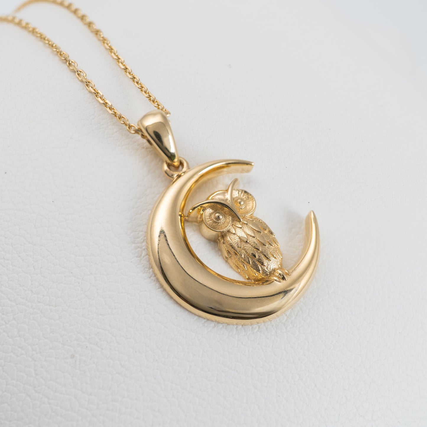 close view of gold owl necklace moon pendant