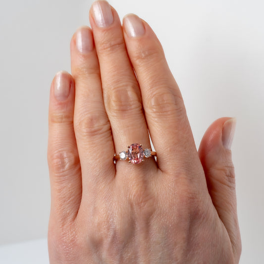 Hunters Fine Jewellery lab created sunrise padparadscha sapphire ring worn on hand