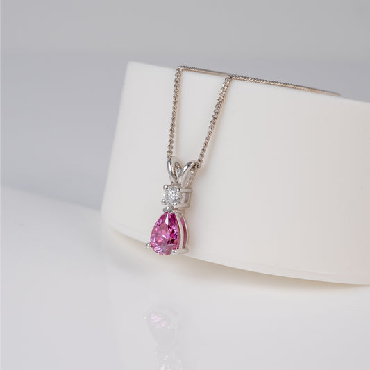 Sterling silver pink moissanite necklace on display stand