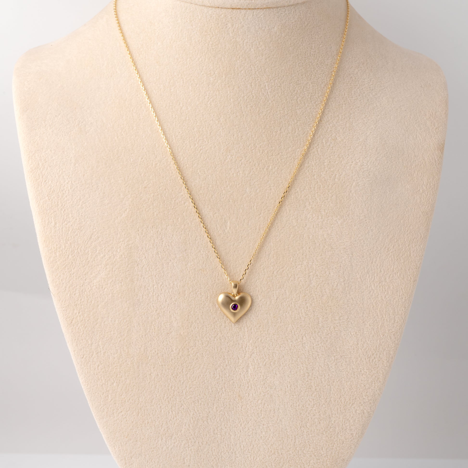 Amethyst heart necklace on display bust with adjustable chain