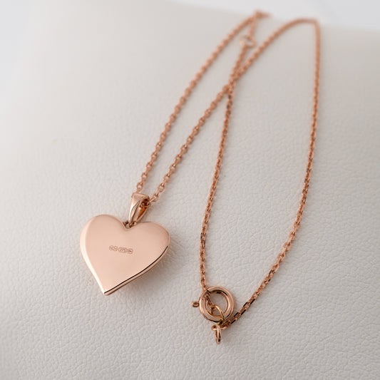Rose gold heart pendant with smooth reverse side and British Assay hallmarks.