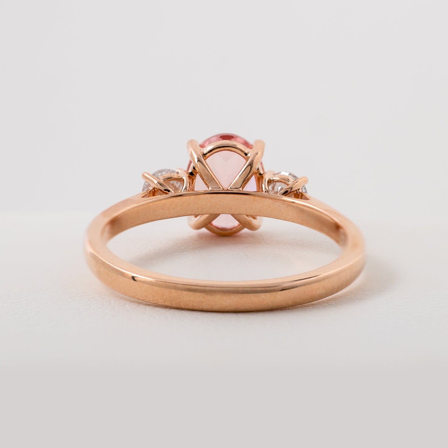 Rear view of lab created padparadscha sapphire ring in rose gold by Hunters Fine Jewellery