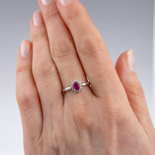 Ruby Diamond Halo Ring in White Gold on Woman's Hand