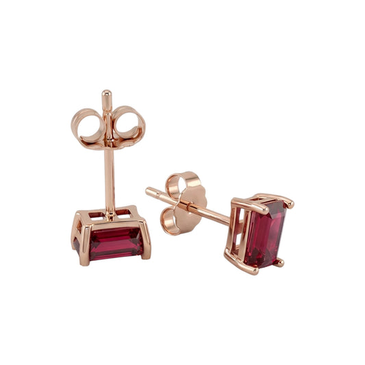 Rose gold earrings with lab ruby gemstones on a white background