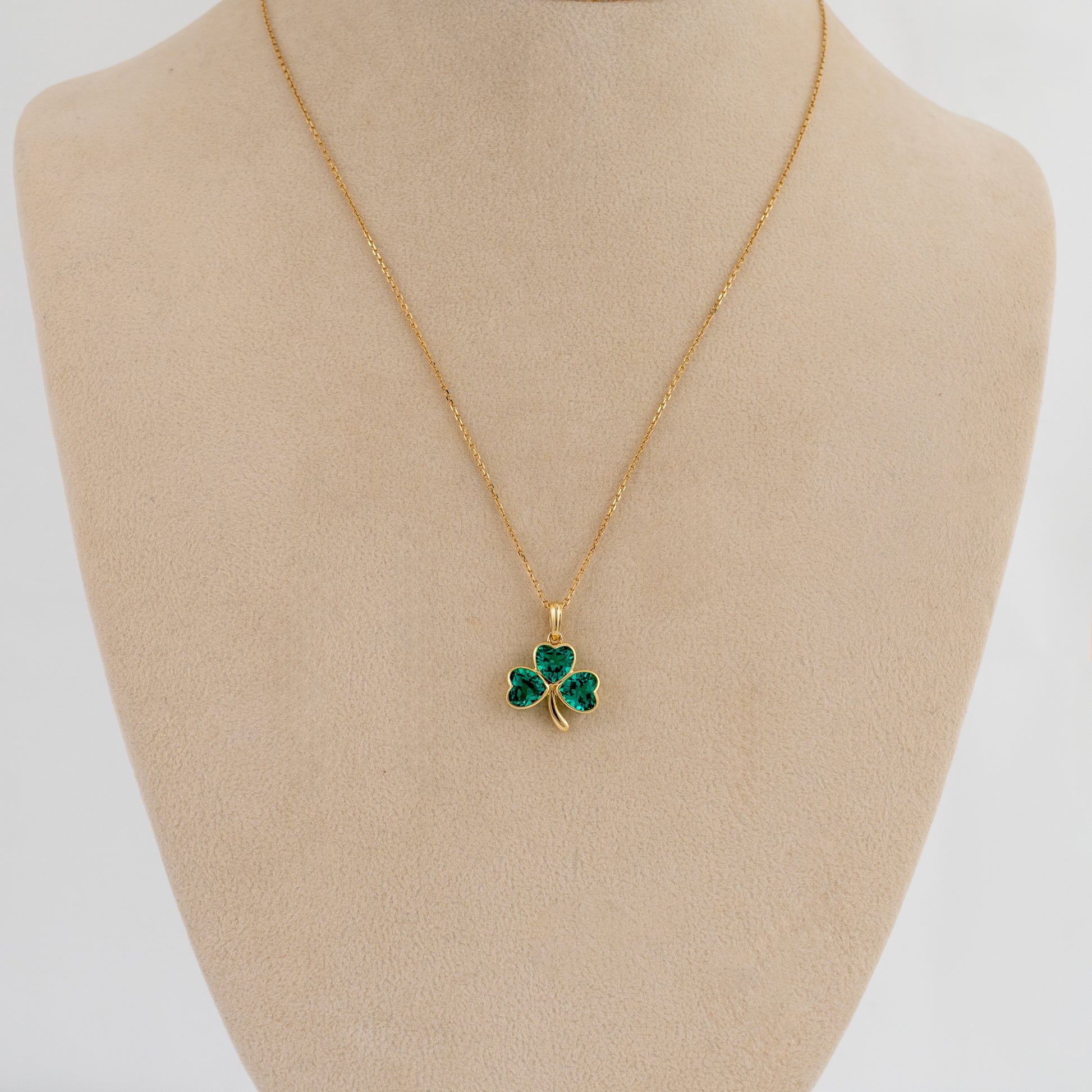 lucky shamrock charm pendant worn on mannequin bust display to show size and chain drop