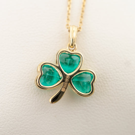 Close-up of edinburgh hallmarks on back 9ct gold shamrock pendant