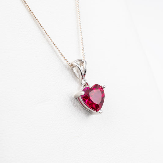 side view of lab-grown ruby heart necklace in sterling silver