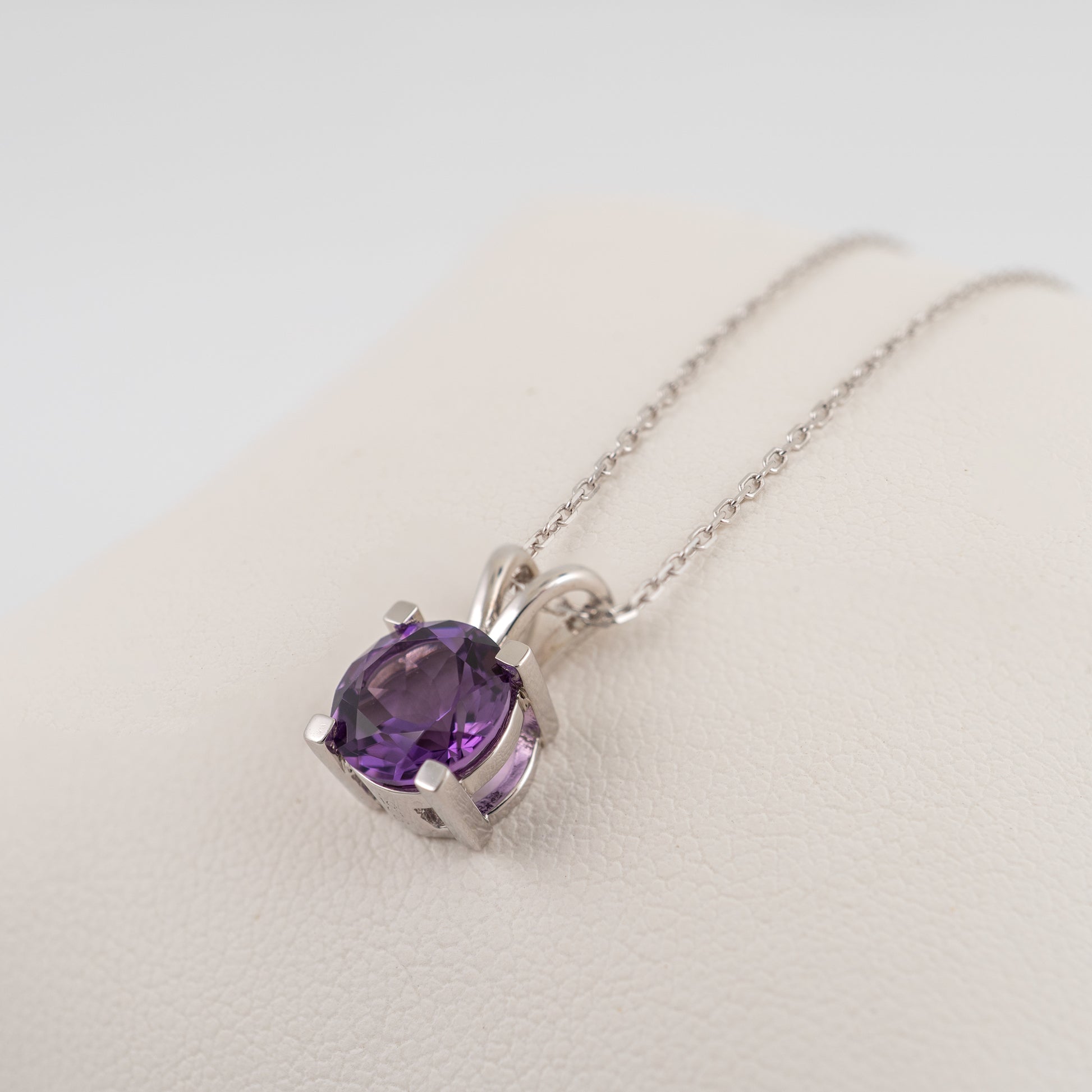 Side angle of silver amethyst necklace showing open V-bale setting