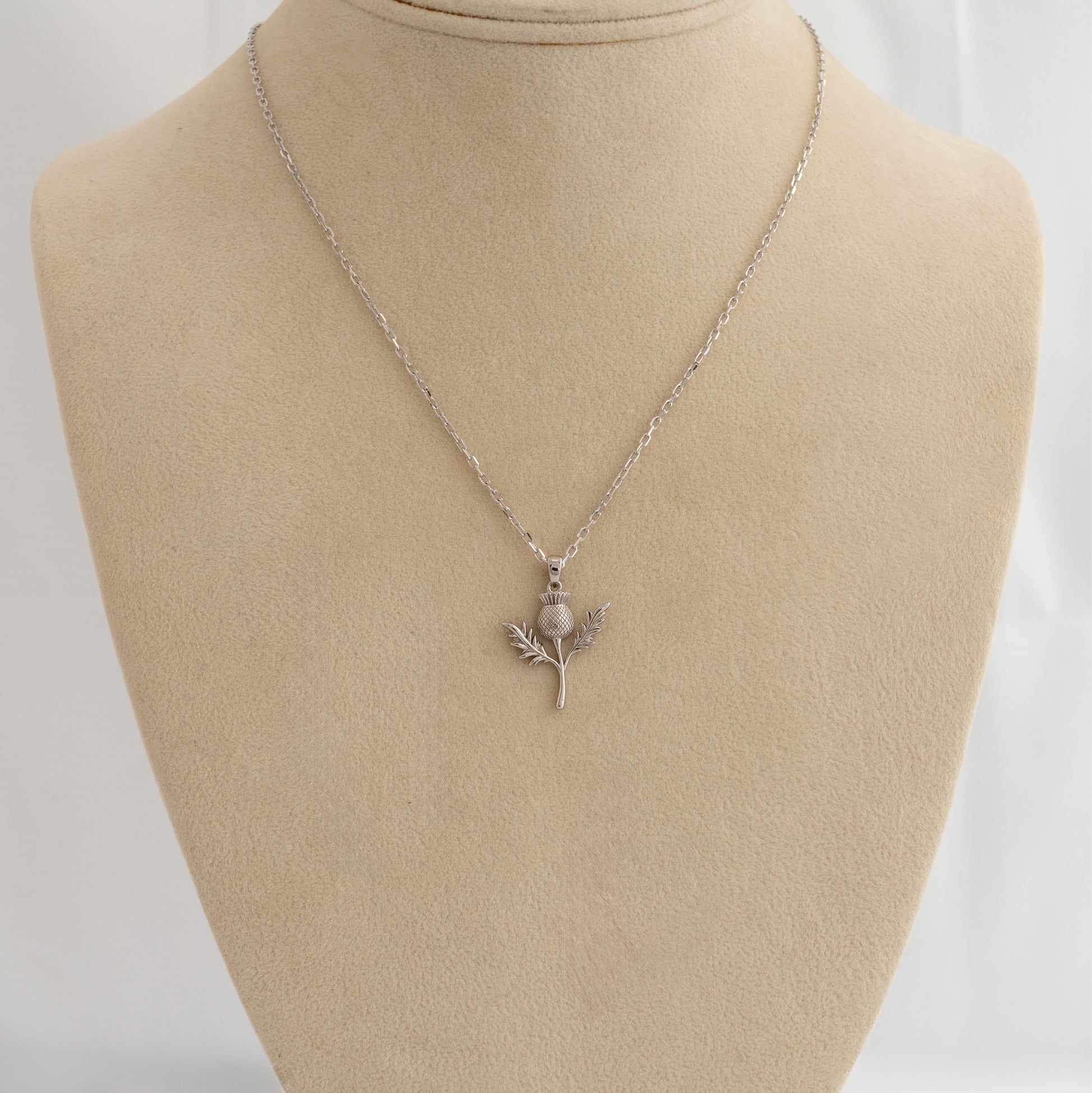 Scottish thistle necklace in sterling silver displayed on mannequin bust