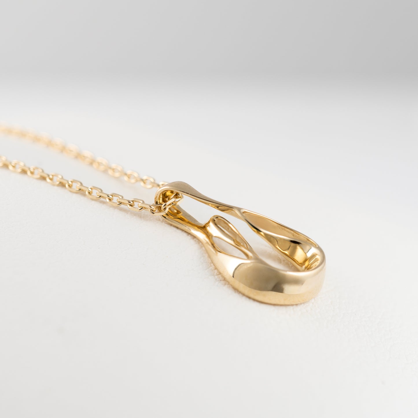 gold pendant integrated bail