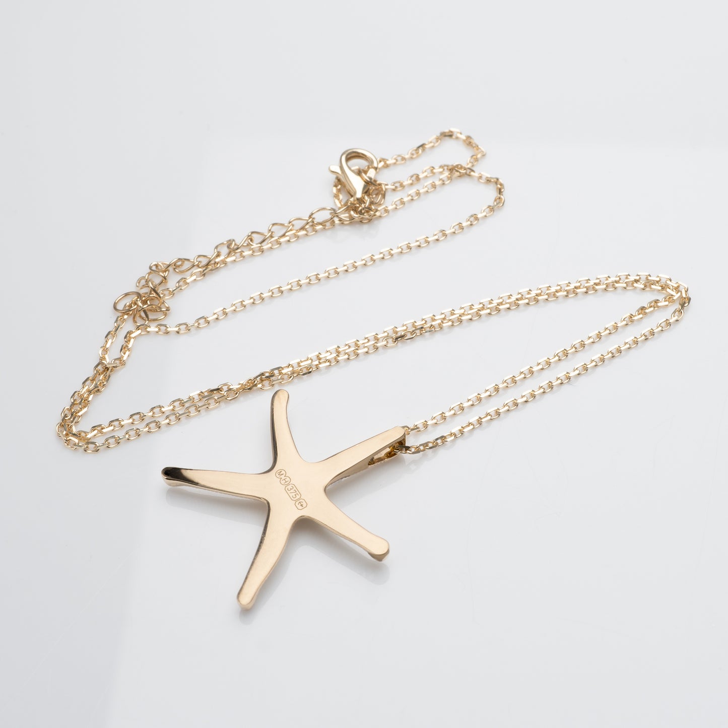 solid gold starfish necklace with british assay hallmarks hunters fine jewellery